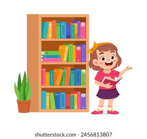 little kid read book in the library