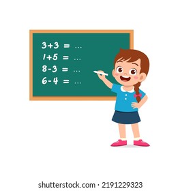 Little Kid Solving Math Problem On Blackboard