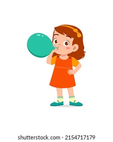 little kid standing and blowing a balloon