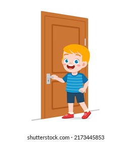 little kid standing and holding door knob