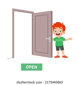 little kid standing and holding door knob