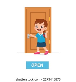 little kid standing and holding door knob