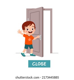 Little Kid Standing And Holding Door Knob