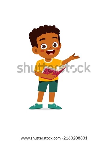 little kid standing and read a book