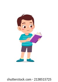 little kid standing and reading a story book