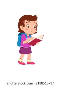 little kid standing and reading a story book
