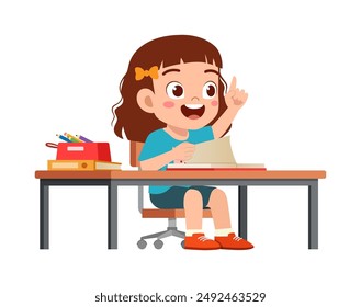 little kid study on desk and raise hand to answer question