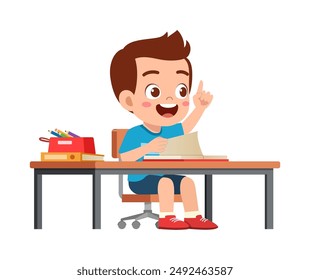 little kid study on desk and raise hand to answer question