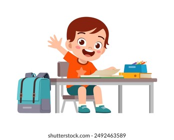 little kid study on desk and raise hand to answer question