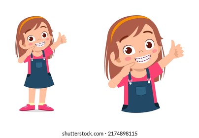 little kid using dental braces and feel happy