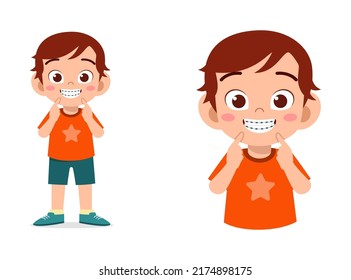 little kid using dental braces and feel happy