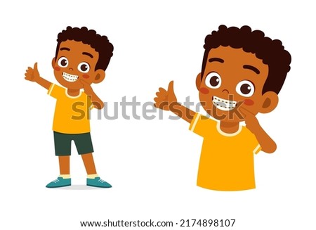 little kid using dental braces and feel happy