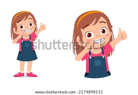 little kid using dental braces and feel happy