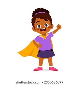 little kid wearing cape and pretending being super hero