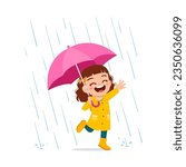 little kid wearing yellow rain coat in the rain and feel happy