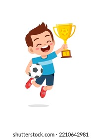 little kid win soccer competition and holding trophy