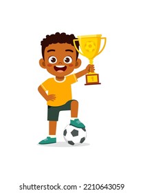 little kid win soccer competition and holding trophy