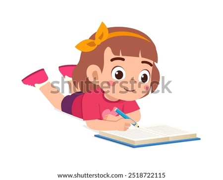 little kid writing a book while lying on stomach on the floor