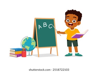 little kid writing on blackboard with chalk to study