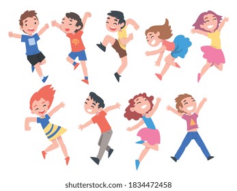 Little Kids Having Fun Set, Cute Happy Preschooler Boys and Girls Wearing Casual Clothes Happily Jumping Cartoon Style Vector Illustration