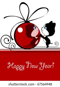 Little kitten playing with a New Year's bal