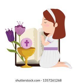 little kneeling girl with bible and flowers first communion