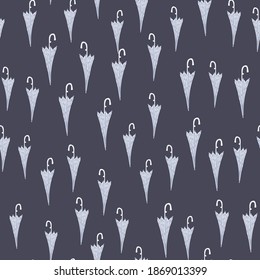 Little light seamless pattern with umbrella ornament. Doodle random accessory print on blue background. Perfect for fabric design, textile print, wrapping, cover. Vector illustration.