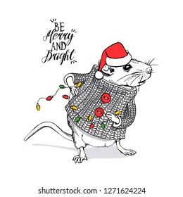 Little Mouse in a white striped pullover and in a Santa's cap, with Garland Lights. Be merry and bright – lettering quote. Christmas and New Year card, t-shirt composition, vector illustration.