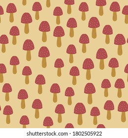 Little mushrooms silhouettes seamless pattern. Light orange background. Red amanitas doodle figures. Great for wallpaper, textile, wrapping paper, fabric print. Vector illustration.