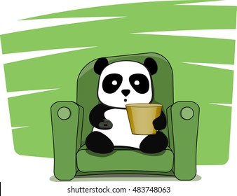 little panda watching television with popcorn. He is sitting on a green couch