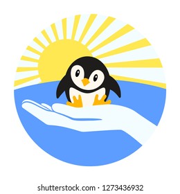 Little penguin on the arm. Round emblem.