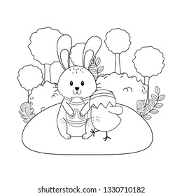 little rabbit and chick with egg painted in the garden