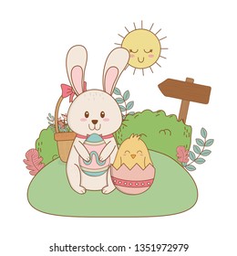little rabbit and chick with egg painted in the garden