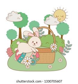 little rabbit with egg painted in basket on the garden