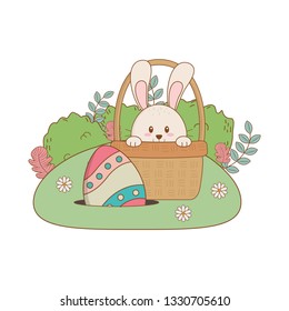 little rabbit with egg painted in basket on the garden