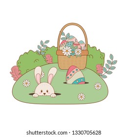 little rabbit with egg painted in basket on the garden