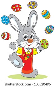 Little rabbit juggling with colorful Easter eggs