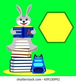 little rabbit sitting on a pile of books and reading a book