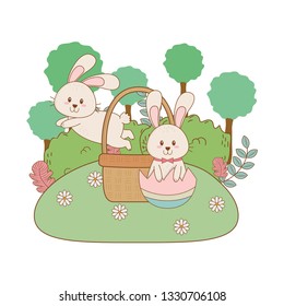 little rabbits with egg painted in the garden