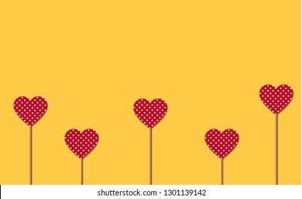 Little red hearts with polka print with sticks isolated on yellow background. Vector symbols of love for Happy Women's, Mother's, Valentine's Day, birthday greeting card design. Vector Illustration.