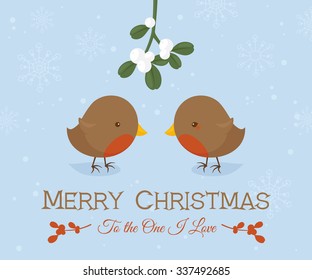 Little robins standing under a sprig of mistletoe.