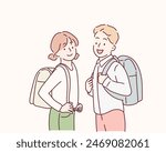 Little school children stand holding books with backpacks. Hand drawn style vector design illustrations.