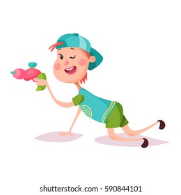Little schoolboy in cap or smiling kid aiming with alien or laser toy gun. Boy or child lying and playing. Playtime and activity, cartoon young happy people and childhood, schoolchildren and youngster