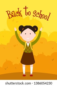 little schoolgirl in a school uniform and with a satchel stands raising her arms against the background of autumn foliage