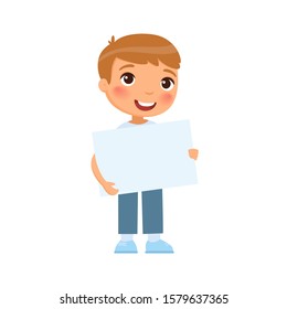 Little smiling boy holding empty banner flat vector illustration. Cute school kid with blank paper sheet in hands isolated on white background. Happy young kid with poster mock up
