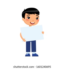 Little smiling boy holding empty banner flat vector illustration. Cute schoolkid with blank paper sheet in hands isolated on white background. Happy young asian kid with poster mock up
