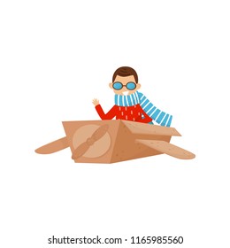 Little smiling boy playing with plane made of cardboard box. Kid dream to becoming pilot. Role play. Flat vector design