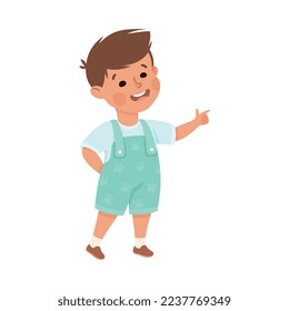 Little Smiling Boy Standing and Pointing with Index Finger Vector Illustration
