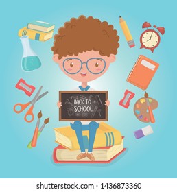 little student boy with chalkboard and school supplies