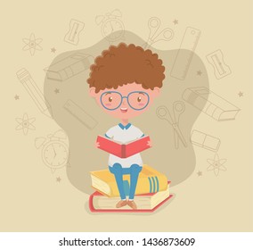 little student boy with school supplies